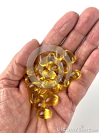 Handful of fish oil capsules Stock Photo